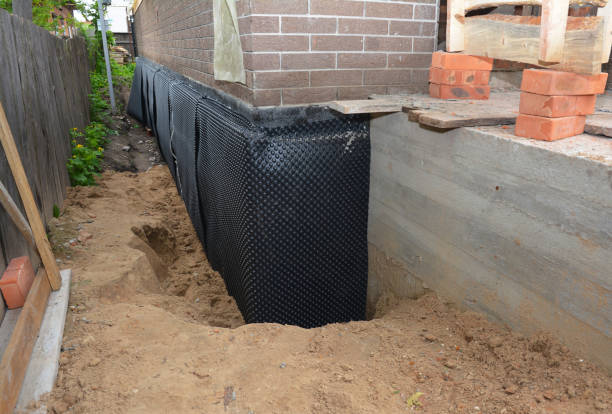 Happy homeowners after waterproofing job in Birmingham